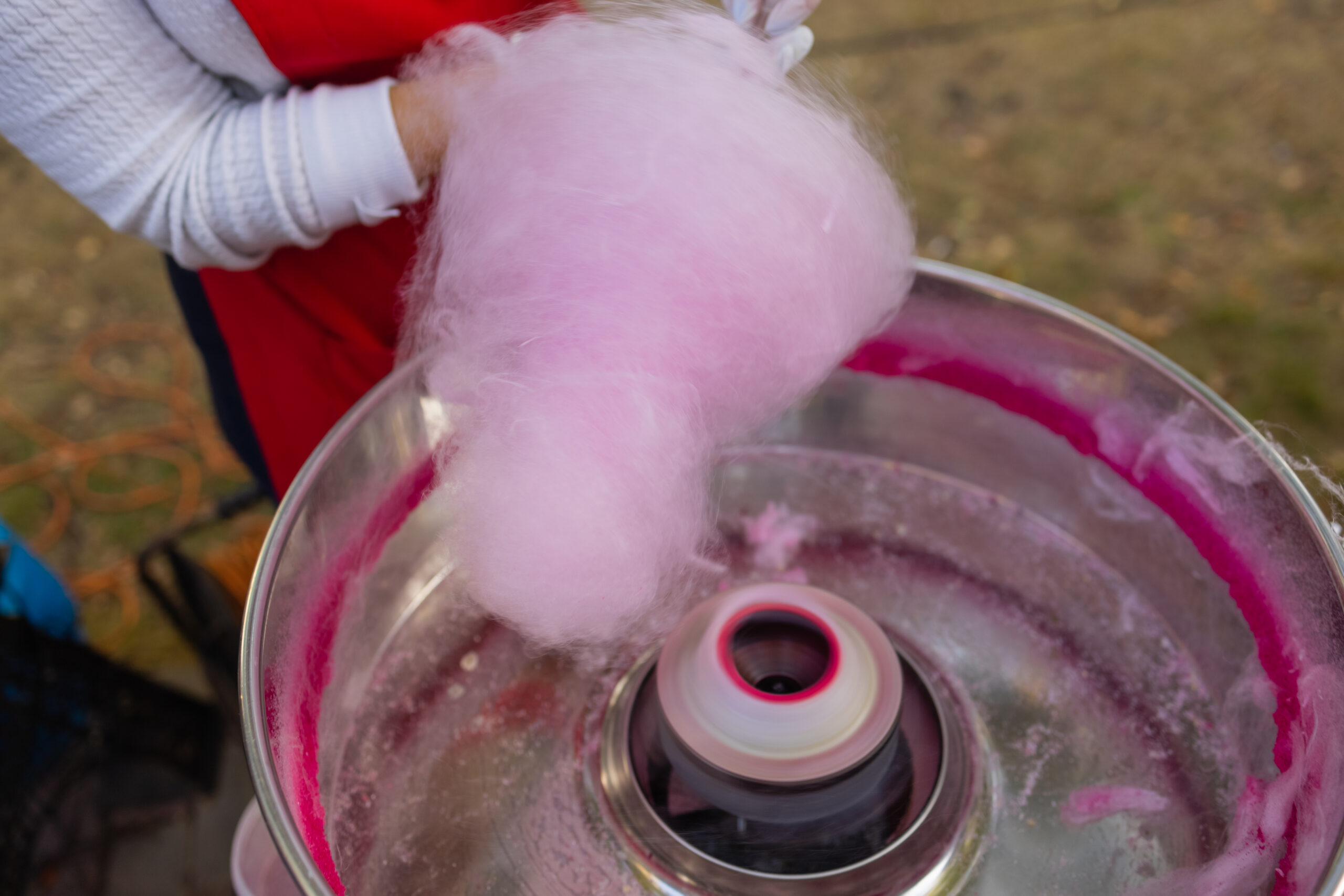 People make cotton candy for children close-up